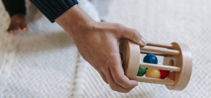 Man holding a cylinder ball