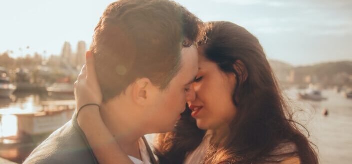 Man and Woman About to Kiss Each Other