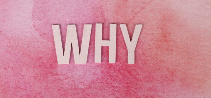 The Word Why on a Pink Background