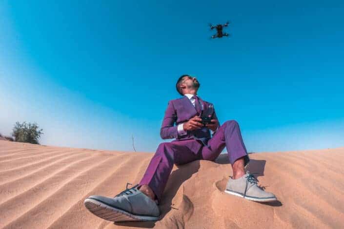 low-angle-photo-of-man-sitting-on-sand-stockpack-pexels