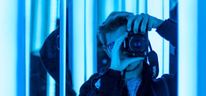 Man Pointing His Camera at a Mirror