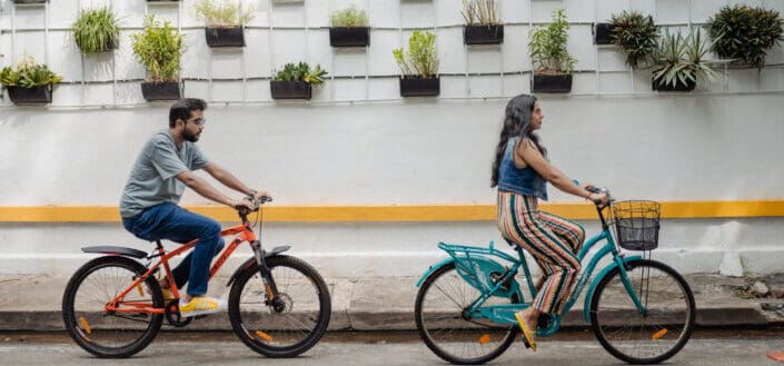 A couple biking together