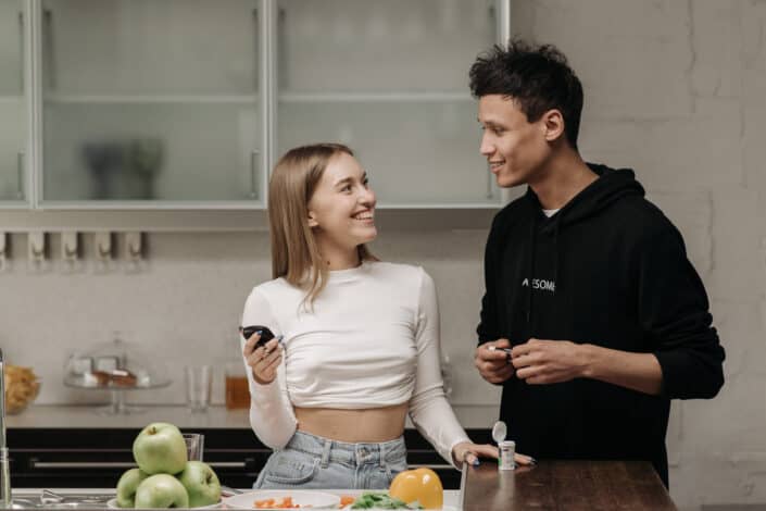 a-couple-looking-at-each-other-while-holding-a-glucometer-stockpack-pexels