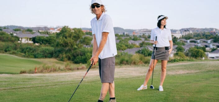 A couple playing golf