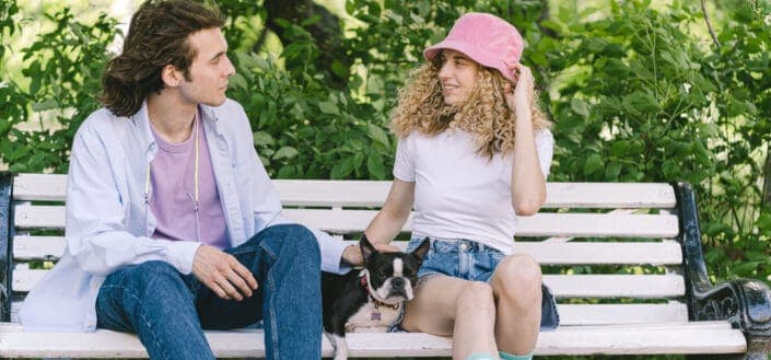 a-man-and-woman-sitting-on-the-bench-with-dog-stockpack-pexels