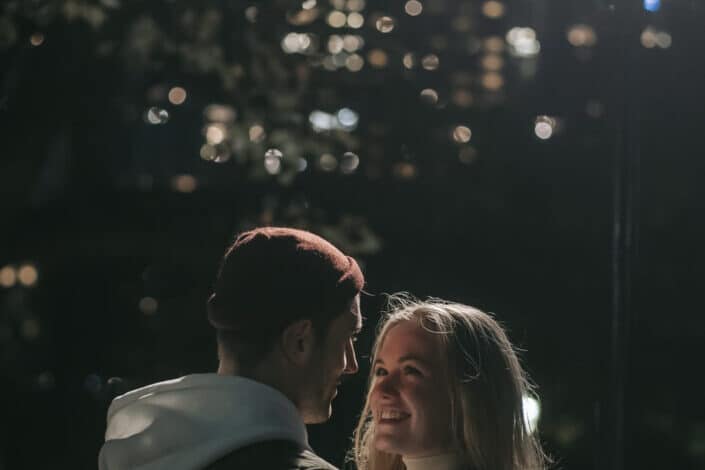 cheerful-couple-hugging-in-park-in-darkness-stockpack-pexels