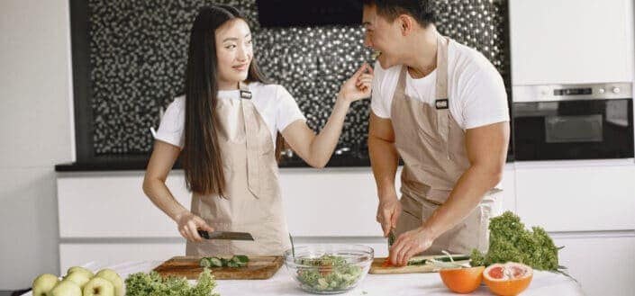 Couple having fun while preparing food together