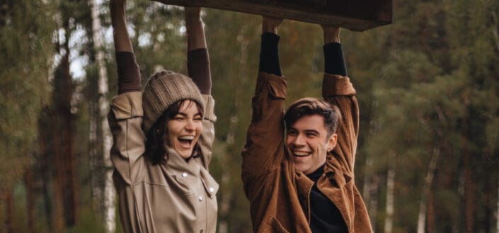 man-and-woman-hanging-from-roof-stockpack-pexels