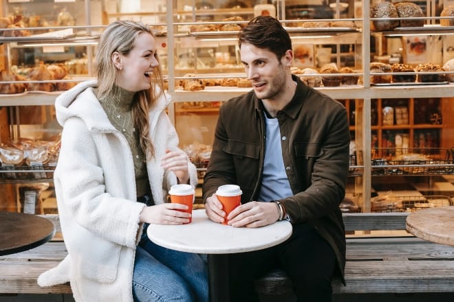 A couple talking while having coffee - conversation games