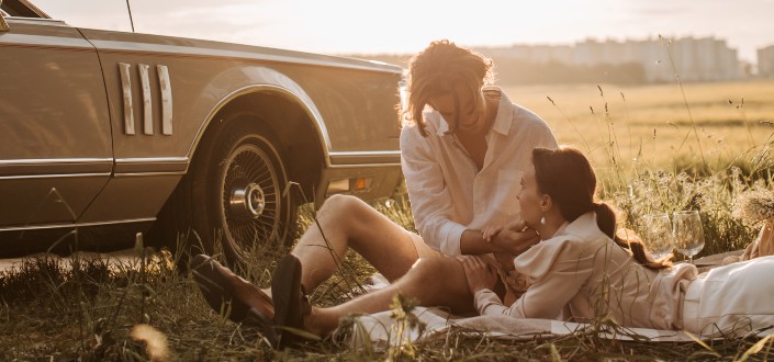 Man and woman beside a car