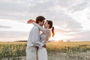 Man and woman hugging in the sunset