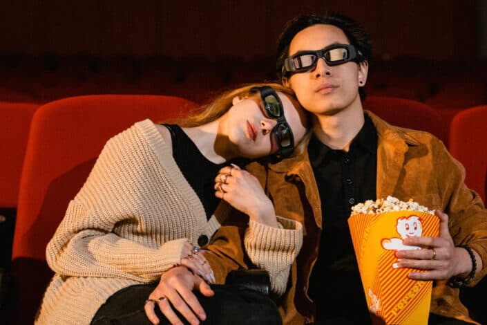 couple watching a 3d movie in a cinema
