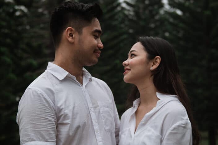 couple in white looking lovingly to each other