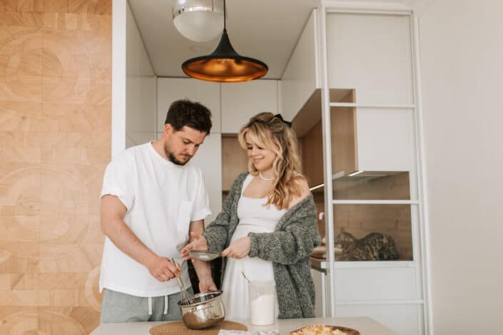 A man and woman cooking together