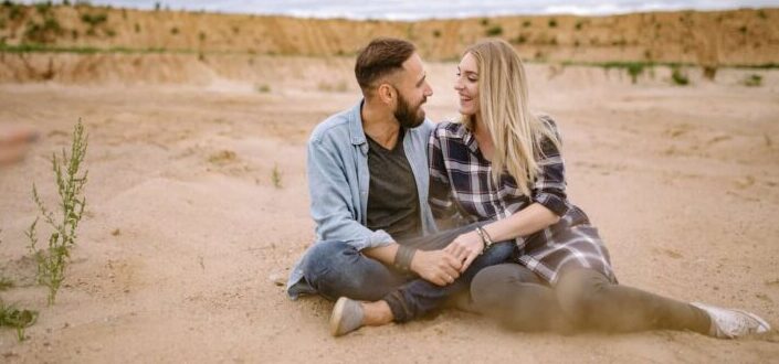 Couple sitting on the sand