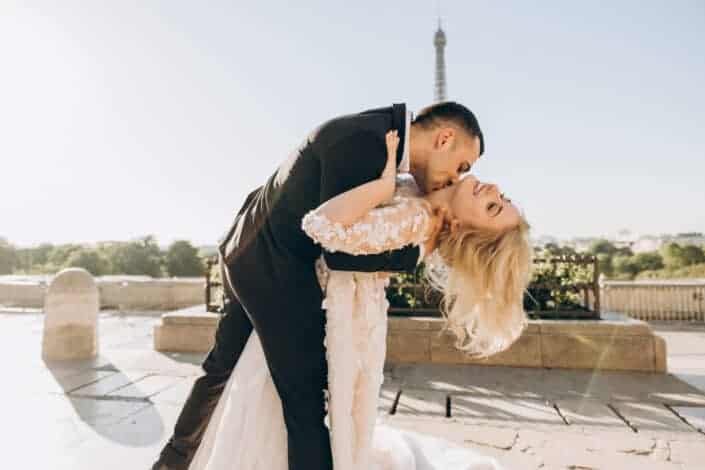 Groom kissing bride neck