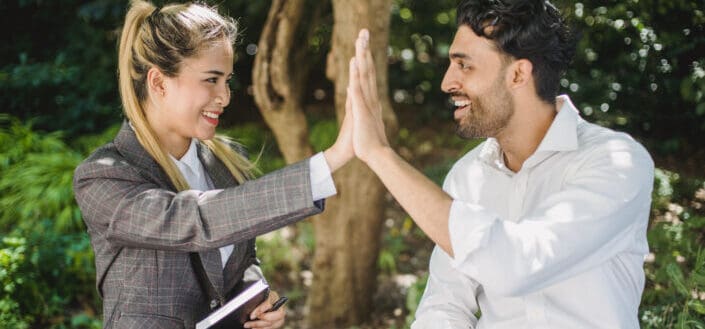 Man and Woman Doing High Five Gesture