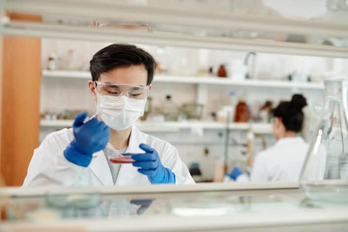 Man Doing Sample Test In Laboratory