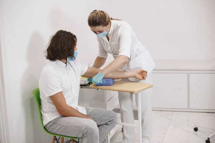 Woman getting blood pressure checked