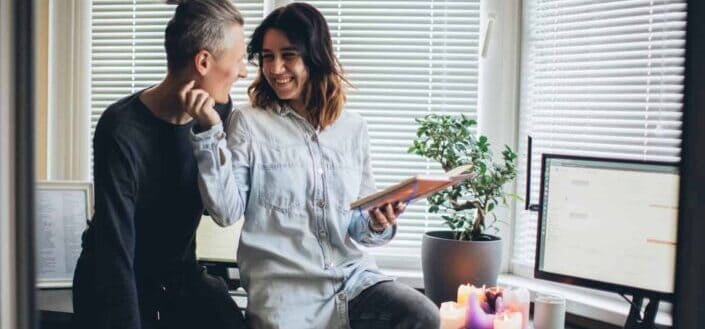 Couple flirting on a desk