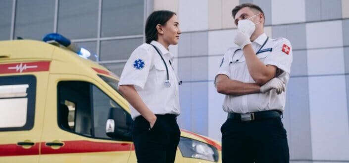 People in White Uniform Having Conversation