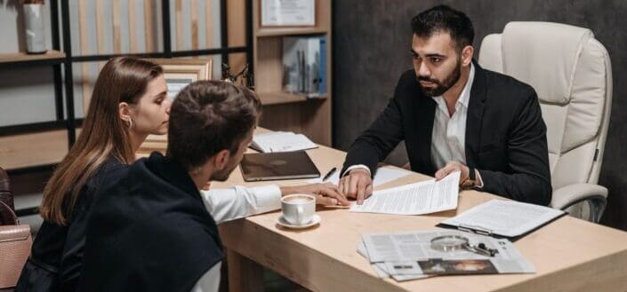 man talking to his client in an office