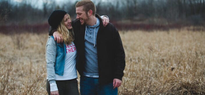 Happy couple at grass field