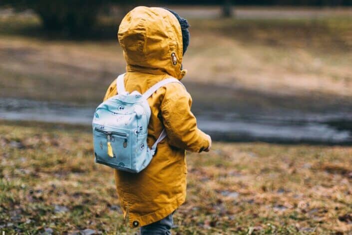 Kid walking near river