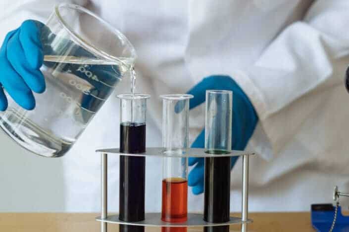 Scientist Examining Chemical Reagents