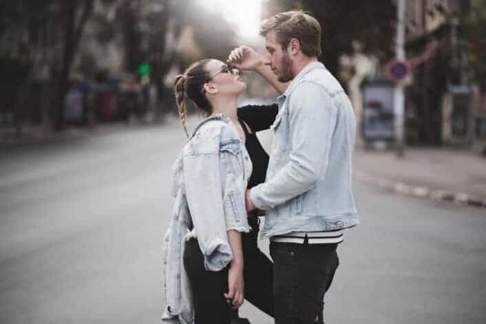 Woman and man standing in front of each other