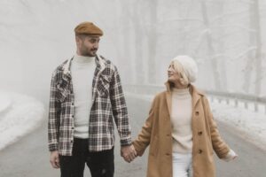 Couple Looking at Each Other while Holding Hands (1)