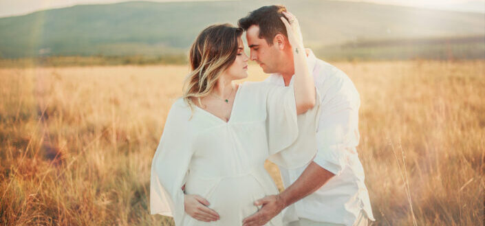 Pregnant Couple in Field