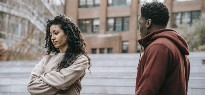 Multiethnic couple arguing in city