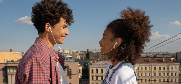 Young Couple Sharing Earphones