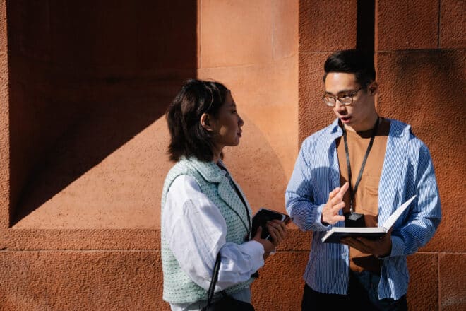 How To Tell Someone You Are Not Interested - Two officemates talking outside the building