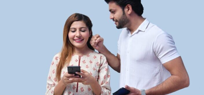 Man and Woman Joking Around While Using Their Phones
