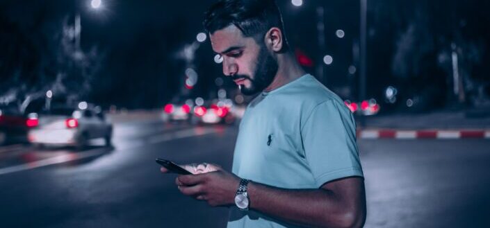 Man on His Phone While Crossing the Street