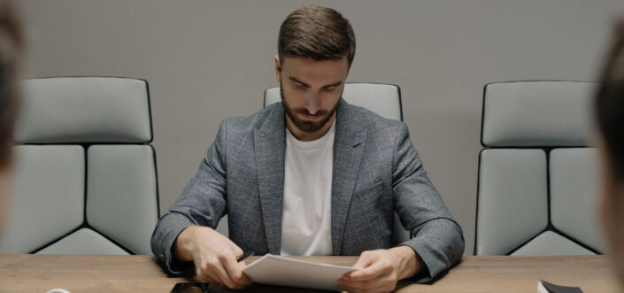 A businessman looking at contract documents