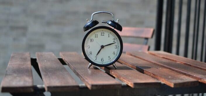 Alarm Clock on a Wooden Table