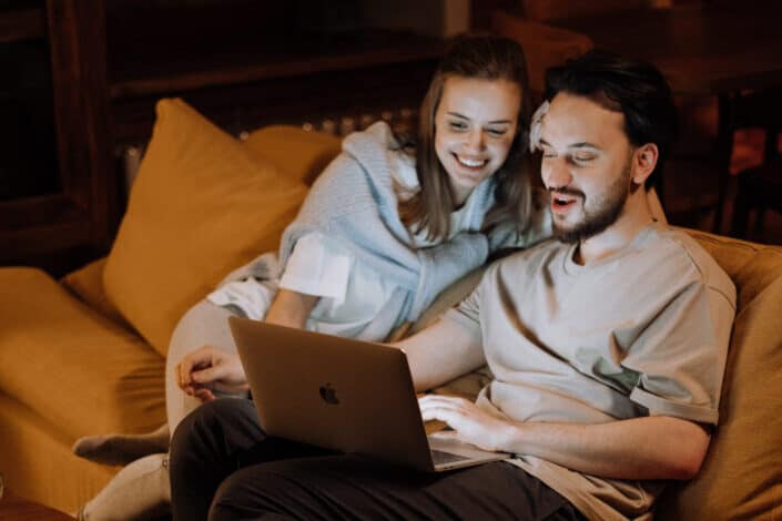 Couple looking at laptop together