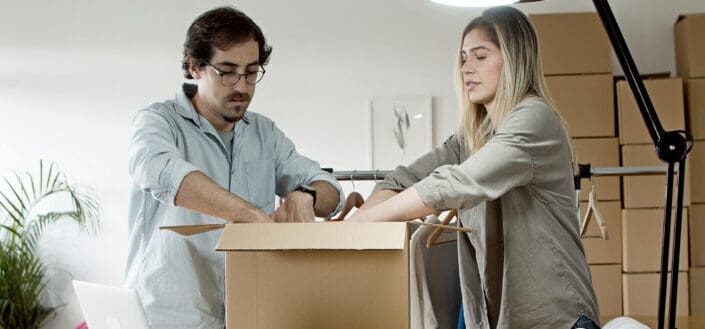 Couple packing products together