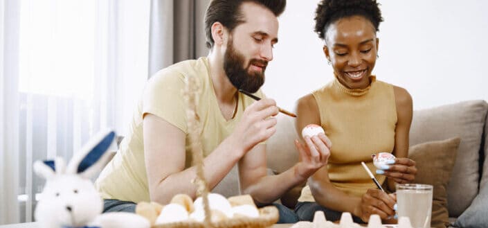 Couple painting on eggs