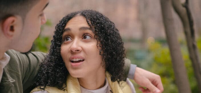 Couple looking at each other in park