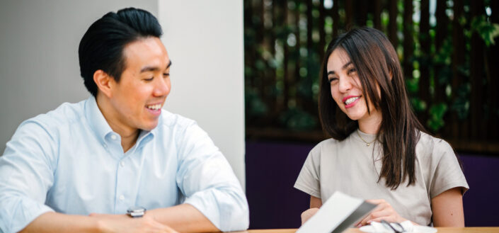 Man and woman talking while sitting