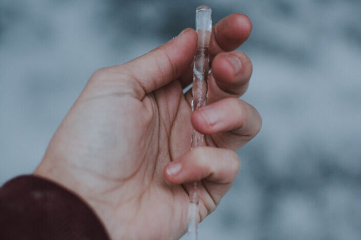 Person holding icicle