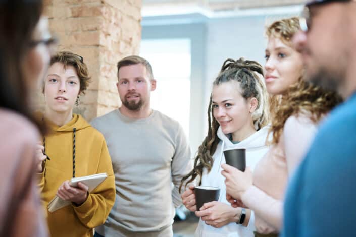 People standing while discussing