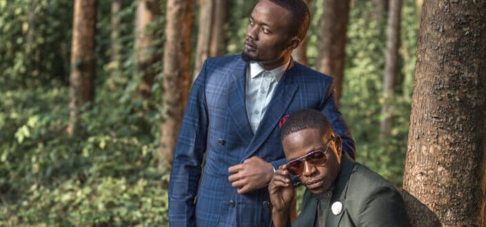 Stylish men posing in the woods