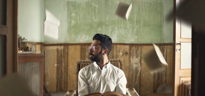 a man staring out the window