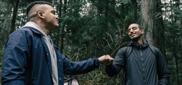 Two men doing fist bumps