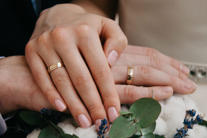 couple wearing their wedding rings